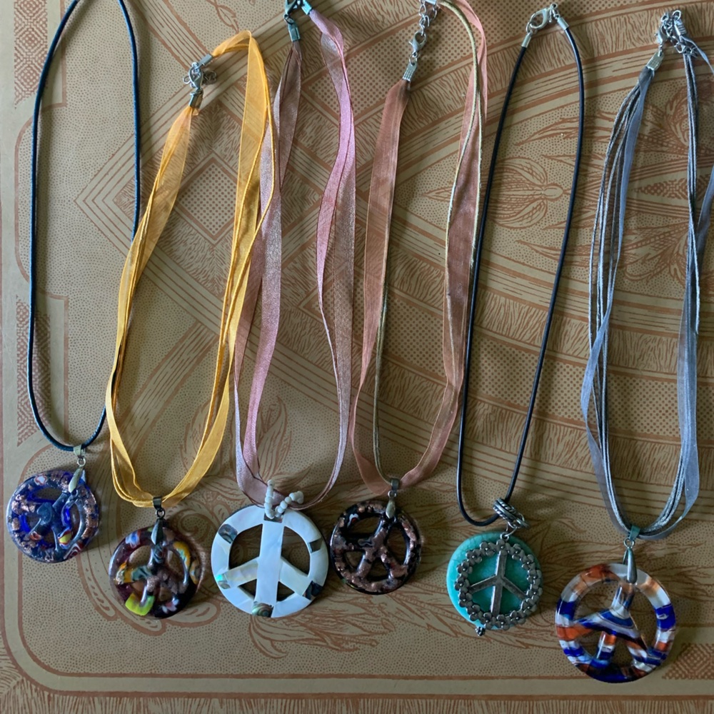 6 Peace Sign necklaces.